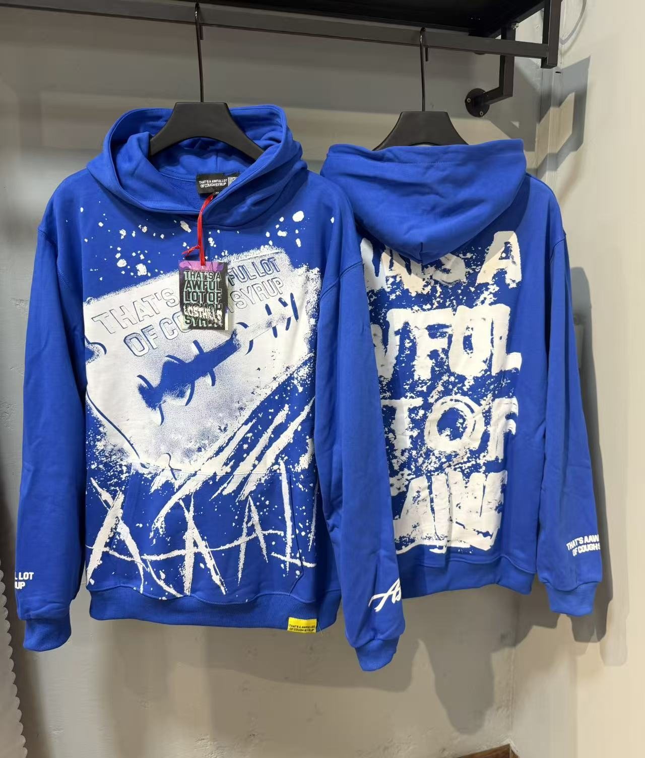 THAT'S A AWFUL LOT OF COUGH SYRUP Star Graphic Pullover Hoodie — context